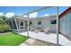 Back patio featuring stylish outdoor seating with decorative cushions, perfect for relaxation and entertaining at 809 40Th St, Sarasota, FL 34234