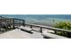Scenic water view from a wooden deck with benches, offering a tranquil spot to relax and enjoy the ocean breeze at 809 40Th St, Sarasota, FL 34234