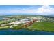 Aerial view showcases a waterfront property with boundaries near a serene bay at 9403 9Th Nw Ave, Bradenton, FL 34209