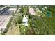 Aerial view of waterfront property featuring tropical landscaping and a tranquil waterway at 9403 9Th Nw Ave, Bradenton, FL 34209