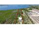 Aerial view of a waterfront property showing boundaries in a lush, tropical setting at 9403 9Th Nw Ave, Bradenton, FL 34209