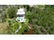 Aerial view of home featuring a refreshing backyard pool and mature trees at 9403 9Th Nw Ave, Bradenton, FL 34209