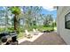 Charming patio with an outdoor kitchen, grill, and lounge seating, set in a lush tropical landscape at 9403 9Th Nw Ave, Bradenton, FL 34209