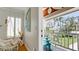 Charming balcony with a blue chair overlooking the lush greenery and clear blue sky at 9403 9Th Nw Ave, Bradenton, FL 34209