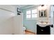 Bright bathroom featuring white subway tiles in the shower and a sleek black vanity with a framed mirror at 9403 9Th Nw Ave, Bradenton, FL 34209