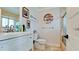 Well-lit bathroom with a clean white vanity, toilet, and shower featuring modern fixtures at 9403 9Th Nw Ave, Bradenton, FL 34209