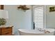 Close up on an elegant tub in a stylish bathroom with a bright window at 9403 9Th Nw Ave, Bradenton, FL 34209