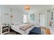 Bright bedroom with unique wallpaper, a cozy daybed, and a charming rattan pendant light at 9403 9Th Nw Ave, Bradenton, FL 34209