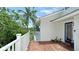 Exterior angle of a charming home with a balcony and a neatly maintained lawn at 9403 9Th Nw Ave, Bradenton, FL 34209