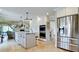 Spacious open kitchen features stainless steel appliances, a central island, and ample cabinet space at 9403 9Th Nw Ave, Bradenton, FL 34209