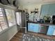 Stylish kitchen featuring stainless steel appliances, blue cabinets, and unique backsplash at 9403 9Th Nw Ave, Bradenton, FL 34209
