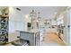 Large open kitchen features stainless steel appliances, a central island, and ample cabinet space at 9403 9Th Nw Ave, Bradenton, FL 34209