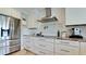 Contemporary kitchen features stainless steel appliances, and white countertops and backsplash at 9403 9Th Nw Ave, Bradenton, FL 34209