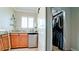 Convenient laundry area with sink, storage cabinets, window, and adjacent walk-in closet at 9403 9Th Nw Ave, Bradenton, FL 34209