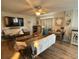 Cozy living room with a ceiling fan, TV, and decor accents, creating a welcoming space at 9403 9Th Nw Ave, Bradenton, FL 34209