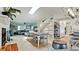 Bright open-concept living room with dining area and stairs at 9403 9Th Nw Ave, Bradenton, FL 34209