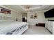 Comfortable main bedroom with tray ceiling, plantation shutters, ample storage, and modern decor at 9403 9Th Nw Ave, Bradenton, FL 34209