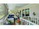 Cozy screened-in porch with comfortable seating and lush green views at 9403 9Th Nw Ave, Bradenton, FL 34209