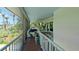 Screened porch with beautiful views, plenty of seating, and ceiling fans at 9403 9Th Nw Ave, Bradenton, FL 34209
