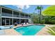 Backyard pool, with a spacious lounge area, grill, and palm trees perfect for entertaining at 9403 9Th Nw Ave, Bradenton, FL 34209
