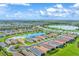 Breathtaking aerial perspective of a serene neighborhood with lakes and manicured lawns at 3025 Veneto Ct, Bradenton, FL 34211