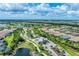 Scenic aerial shot showcasing a gated community with ponds, lush landscaping, and winding roads at 3025 Veneto Ct, Bradenton, FL 34211