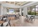 Bright amenity space with a kitchen bar, large windows, and a comfortable seating area at 3025 Veneto Ct, Bradenton, FL 34211