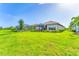 Beautiful home with spacious backyard, screened patio, lush landscaping and stunning pond view at 3025 Veneto Ct, Bradenton, FL 34211