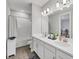 Bright bathroom with double sinks, quartz countertops, and a shower-tub combo at 3025 Veneto Ct, Bradenton, FL 34211