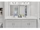 Bathroom featuring double sinks, quartz countertops and undermount cabinets for storage at 3025 Veneto Ct, Bradenton, FL 34211