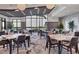 Spacious dining room with tables, chairs, and large windows showcasing scenic views at 3025 Veneto Ct, Bradenton, FL 34211