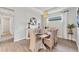 Light and airy dining room featuring coastal decor, modern accents, and tile flooring at 3025 Veneto Ct, Bradenton, FL 34211