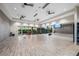 Bright exercise room with mirrors, TVs, weight racks, and wood-look flooring at 3025 Veneto Ct, Bradenton, FL 34211
