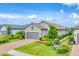 Charming single-Gathering home boasting a lush landscaped yard and a welcoming two-car garage at 3025 Veneto Ct, Bradenton, FL 34211