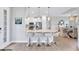 Modern kitchen with white cabinets, a large island, and stainless steel appliances at 3025 Veneto Ct, Bradenton, FL 34211