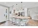 Stylish kitchen featuring a central island with bar stools, perfect for entertaining at 3025 Veneto Ct, Bradenton, FL 34211