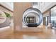 Open lobby area with modern artwork and an entryway to Olive & Vine restaurant at 3025 Veneto Ct, Bradenton, FL 34211