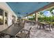 Inviting outdoor seating area with tables and chairs, perfect for dining and relaxation at 3025 Veneto Ct, Bradenton, FL 34211