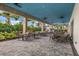 Inviting outdoor seating area with tables and chairs, perfect for dining and relaxation at 3025 Veneto Ct, Bradenton, FL 34211