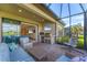 Covered patio with outdoor kitchen and comfortable seating, great for entertaining and relaxation at 3025 Veneto Ct, Bradenton, FL 34211