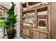 Close-up of wooden shelving unit displaying spa products and decorative items at 3025 Veneto Ct, Bradenton, FL 34211