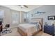 Relaxing bedroom with desk, shark decor, plantation shutters, and neutral tones at 11200 Whimbrel Ln, Sarasota, FL 34238
