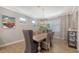 Charming dining room with elegant chandelier and neutral tones at 11200 Whimbrel Ln, Sarasota, FL 34238