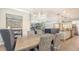 Dining room with an elegant chandelier, connecting the kitchen and living area at 11200 Whimbrel Ln, Sarasota, FL 34238