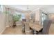 Dining room with modern chandelier, overlooking backyard at 11200 Whimbrel Ln, Sarasota, FL 34238
