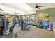 Well-equipped fitness center with machines, weights, and ample space for workouts at 11200 Whimbrel Ln, Sarasota, FL 34238