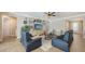Bright living room featuring tile flooring, modern furnishings, and a cozy atmosphere at 11200 Whimbrel Ln, Sarasota, FL 34238