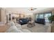 Bright open concept living room with tile flooring and plenty of natural light at 11200 Whimbrel Ln, Sarasota, FL 34238