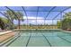 Screened pool overlooks the water and surrounding community at 11200 Whimbrel Ln, Sarasota, FL 34238