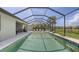Home's screened pool overlooks the water and surrounding community at 11200 Whimbrel Ln, Sarasota, FL 34238